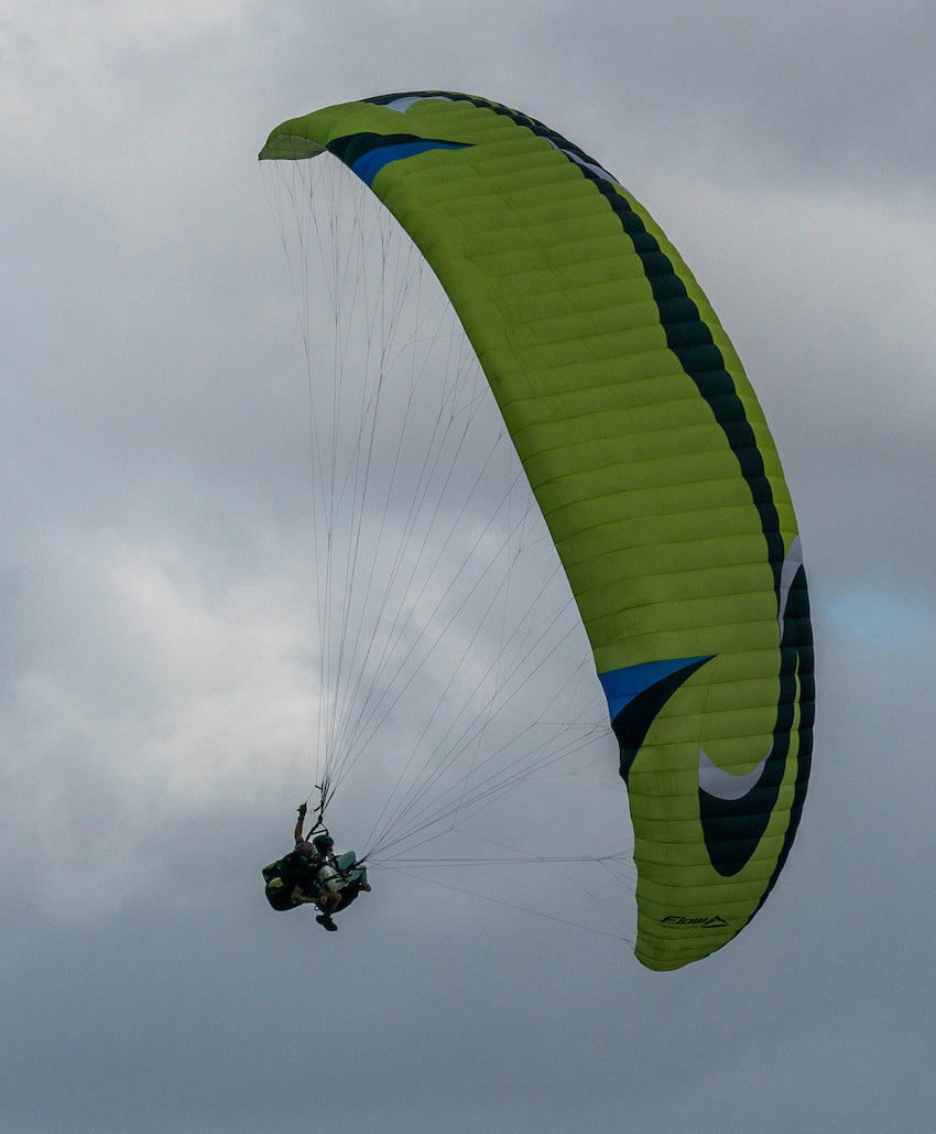Person flying a flow panorama paraglider at Signal Hill South Africa.