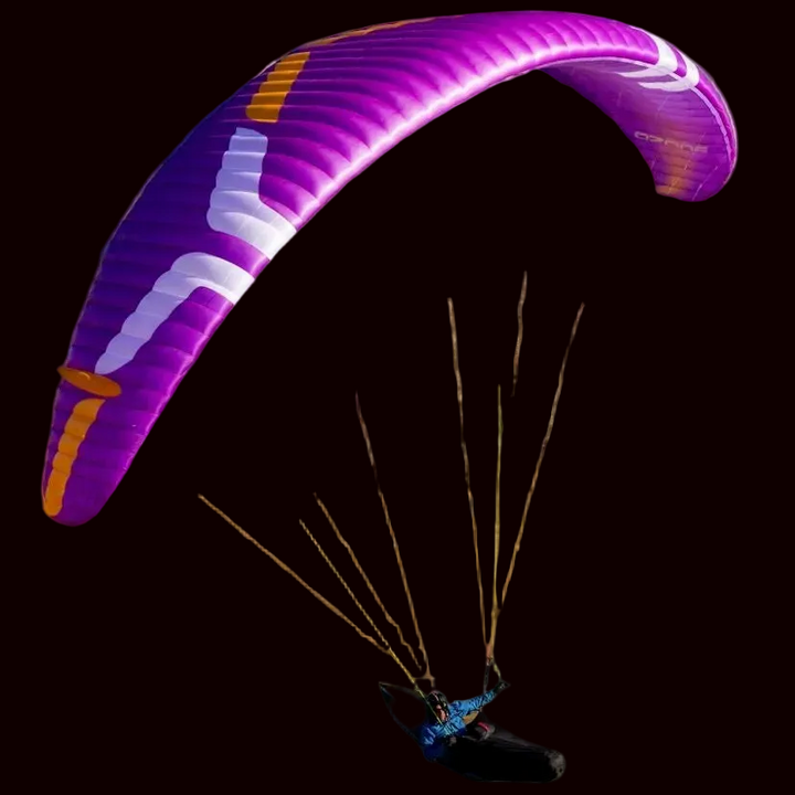 Purple paraglider against a black background