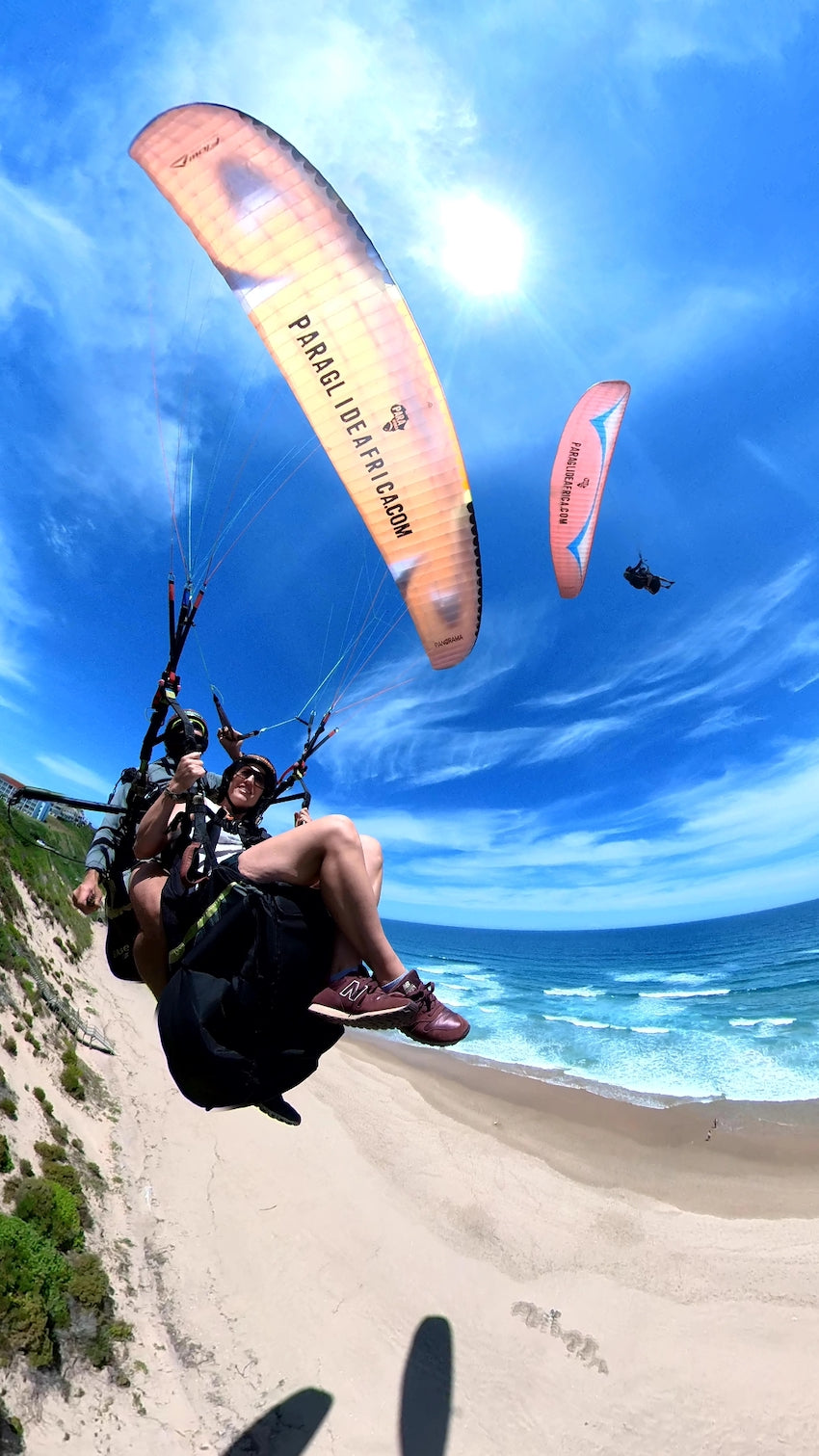 Tandem paragliding over the beach in the Garden Route with Paraglide Africa