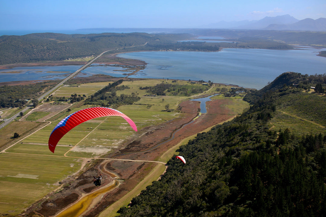 red paraglider over Swartvlei